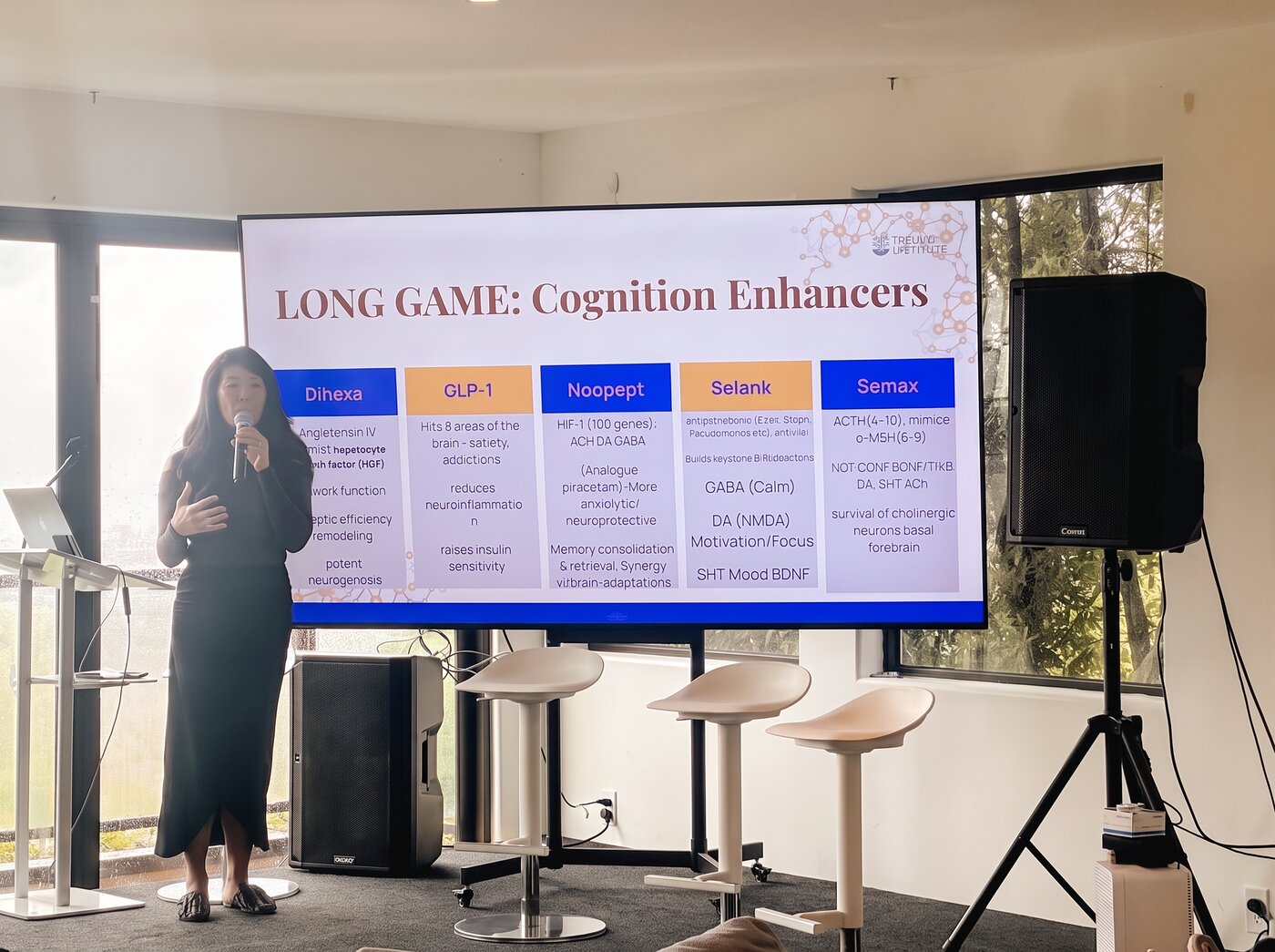 Grace Liu presenting a slide on cognition-enhancing peptides